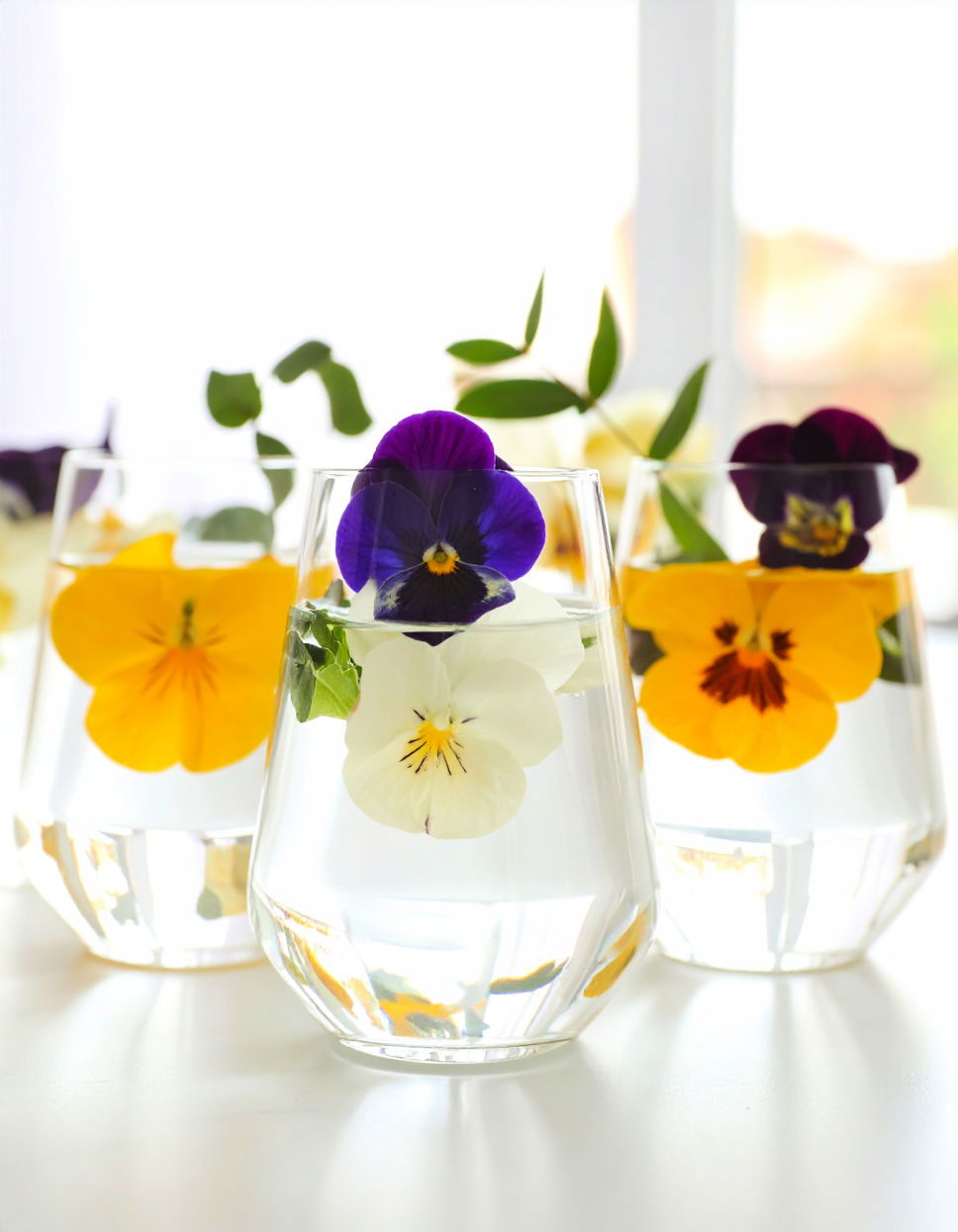 Floating Pansies in Elegant Glass Vase