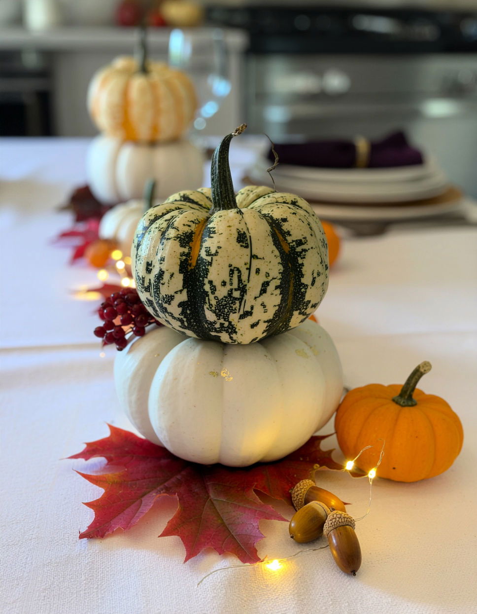 Hand Painted Pumpkins with Seasonal Accents Thanksgiving Centerpiece Ideas