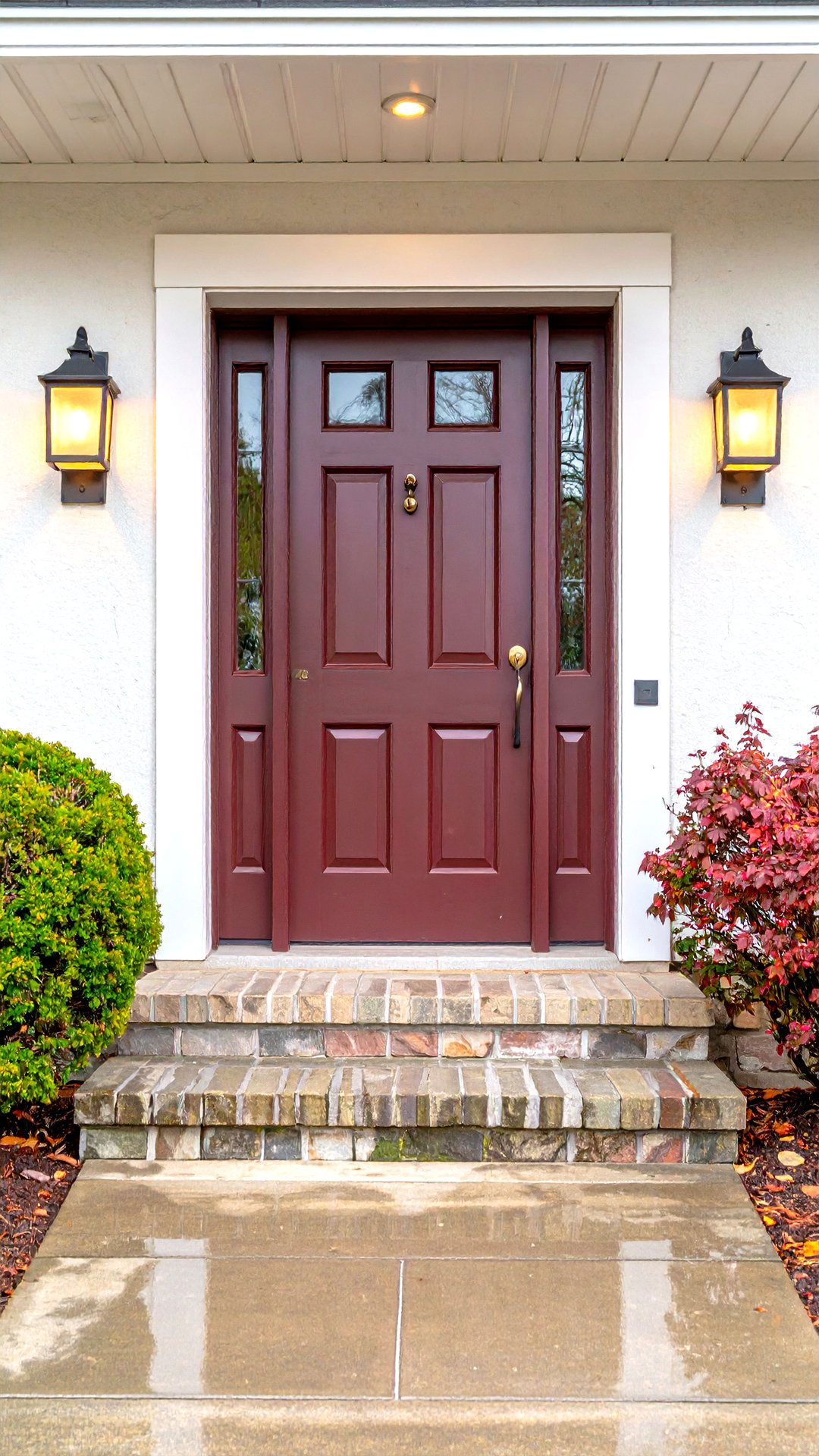 Burgundy Door Enhanced by Warm White Lighting - 25 burgundy front door ideas