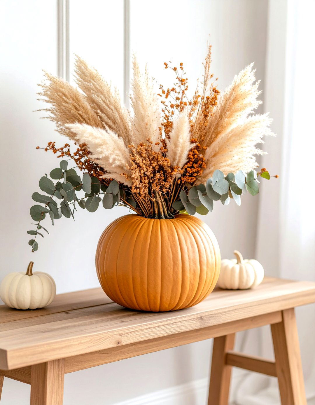 Pumpkin Vase Brimming with Pampas Grass on an Entry Bench - 25 pampas grass decor ideas