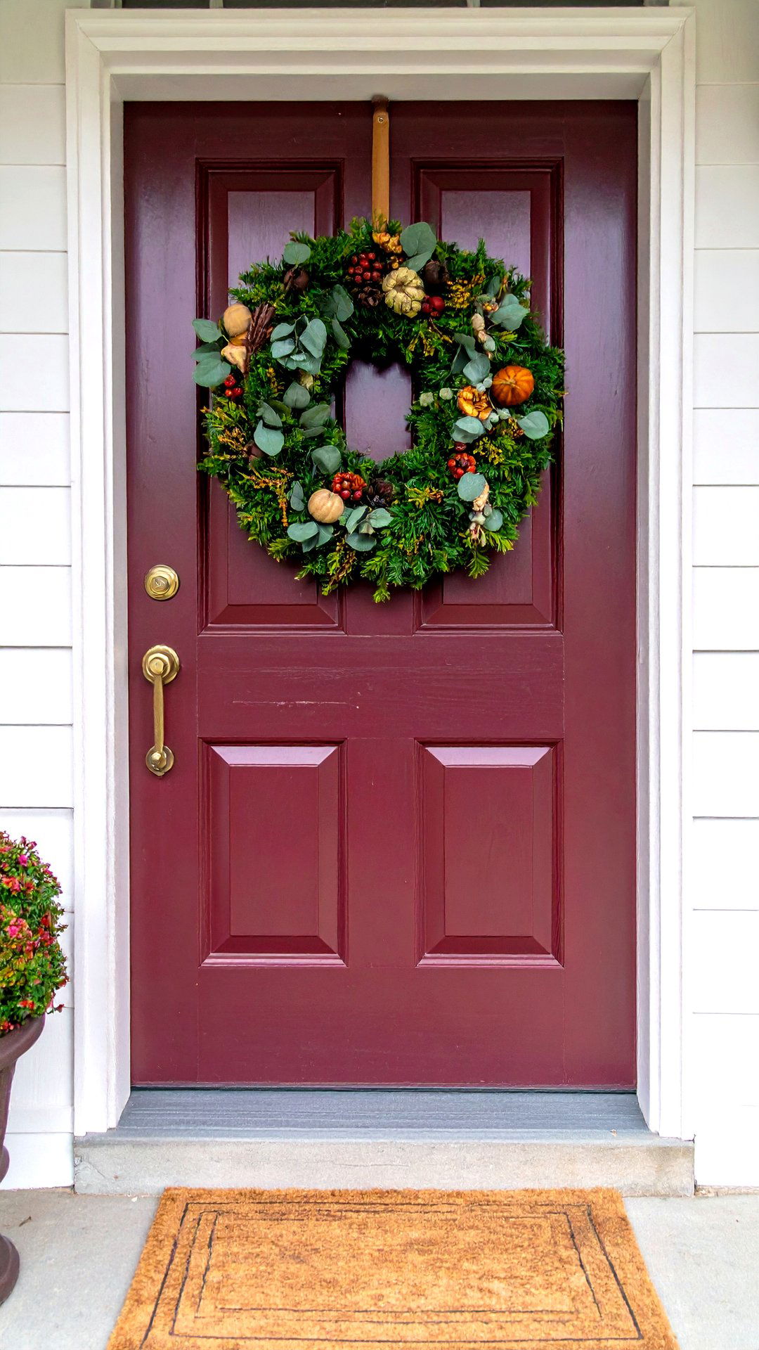 Seasonal Greenery on a Burgundy Canvas - 25 burgundy front door ideas